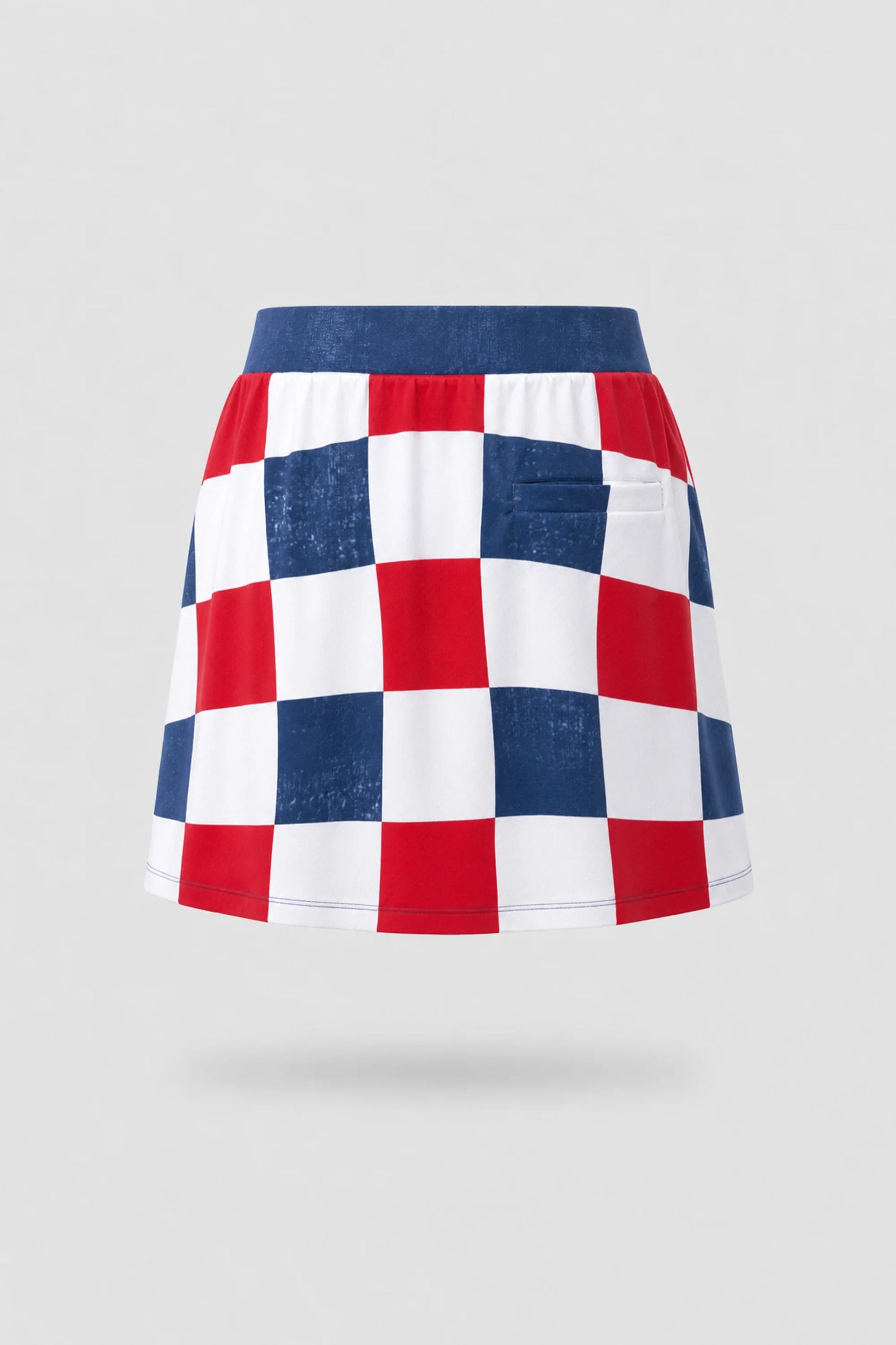 Back view of women's patterned golf skort featuring Liberty Check print and lightweight stretch performance fabric