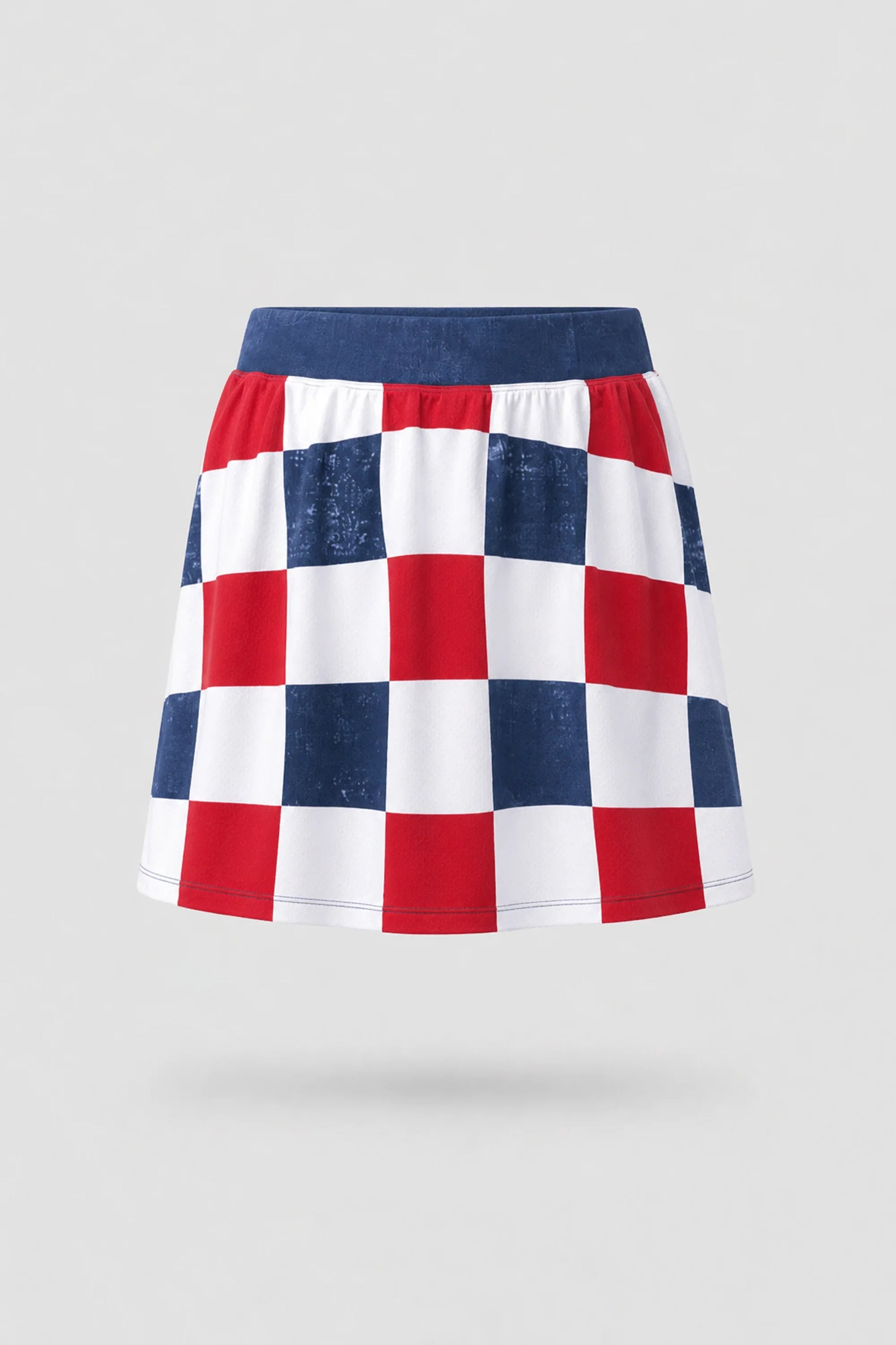 Women's patterned golf skort in Liberty Check print with A-line silhouette and comfortable wide waistband