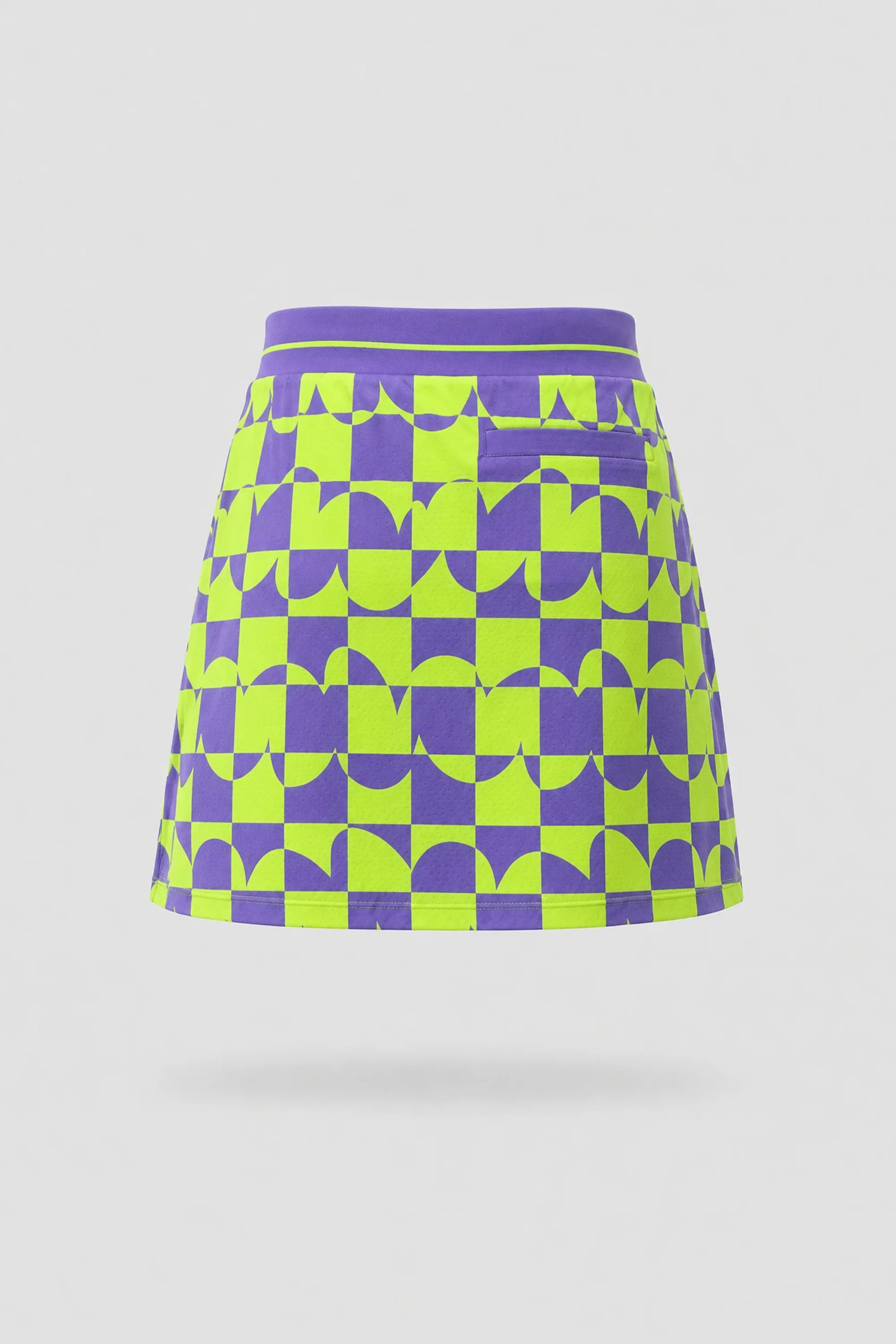 Back view of women's patterned golf skort featuring Paradox Geo design and lightweight stretch fabric