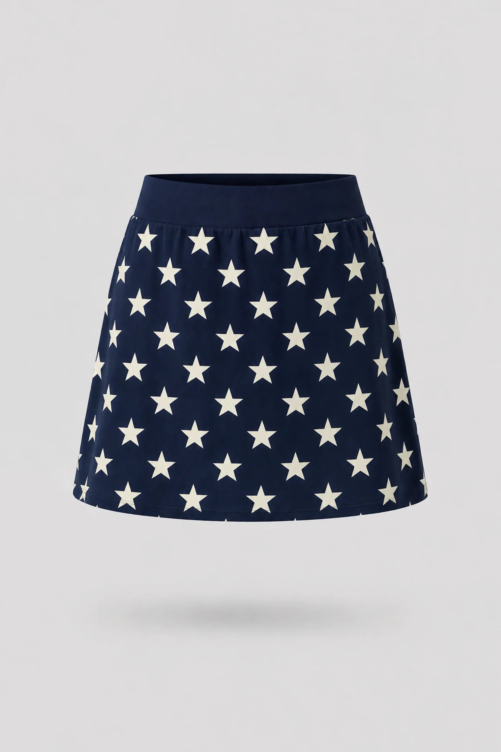 Women's patterned golf skort in Starfield print with A-line silhouette and comfortable wide waistband