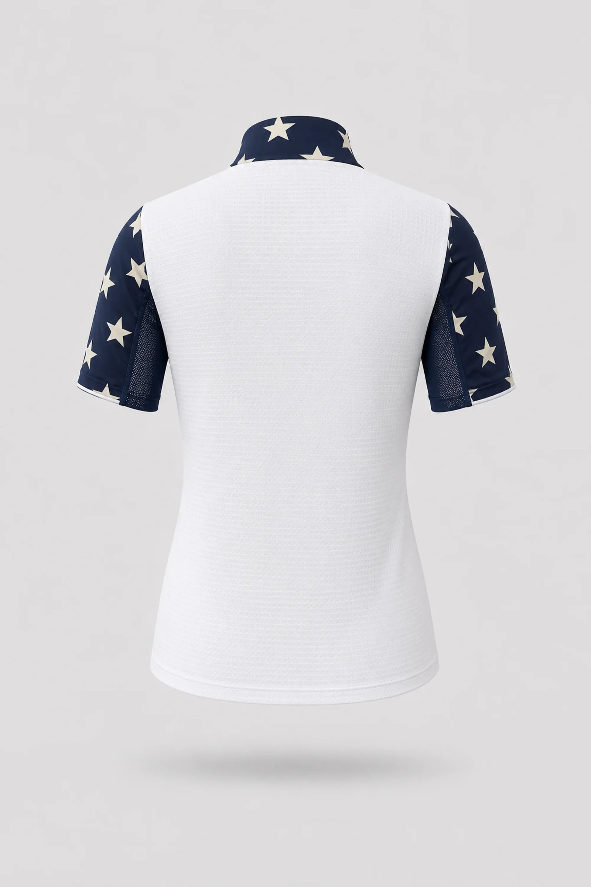 Back view of women's patterned golf top featuring Starfield print and stretch performance fabric