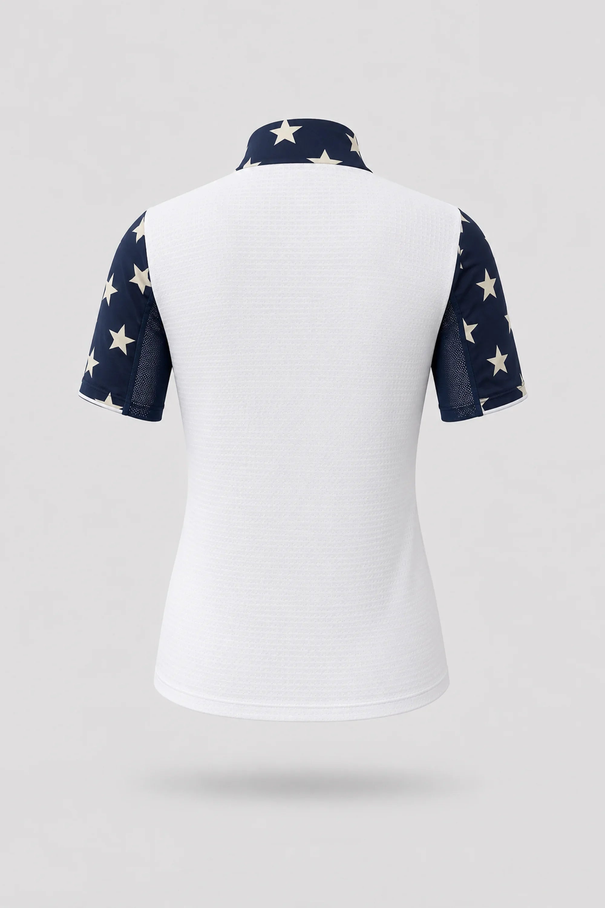 Back view of women's patterned golf top featuring Starfield print and stretch performance fabric