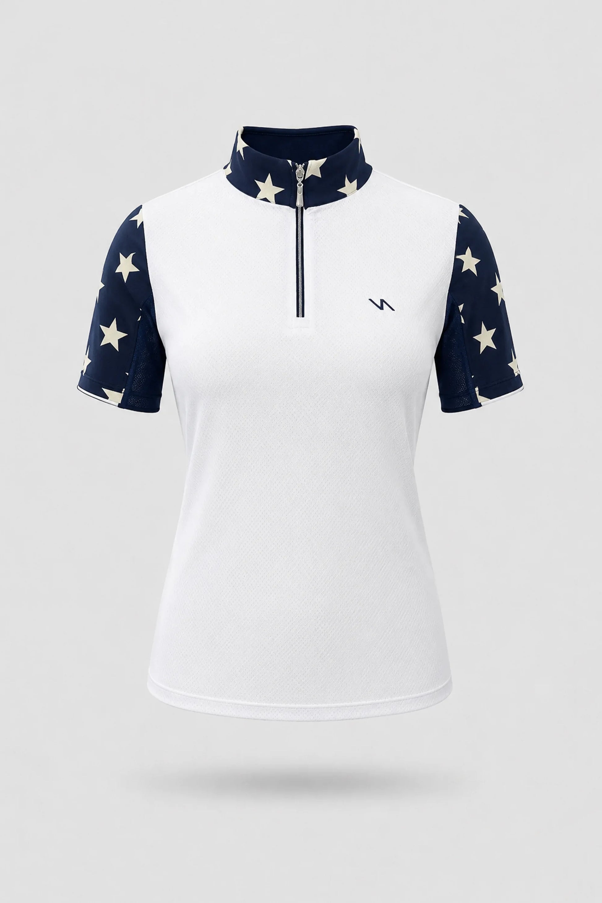 Women's patterned golf top in Starfield print with zip neck design and contrast panel detailing