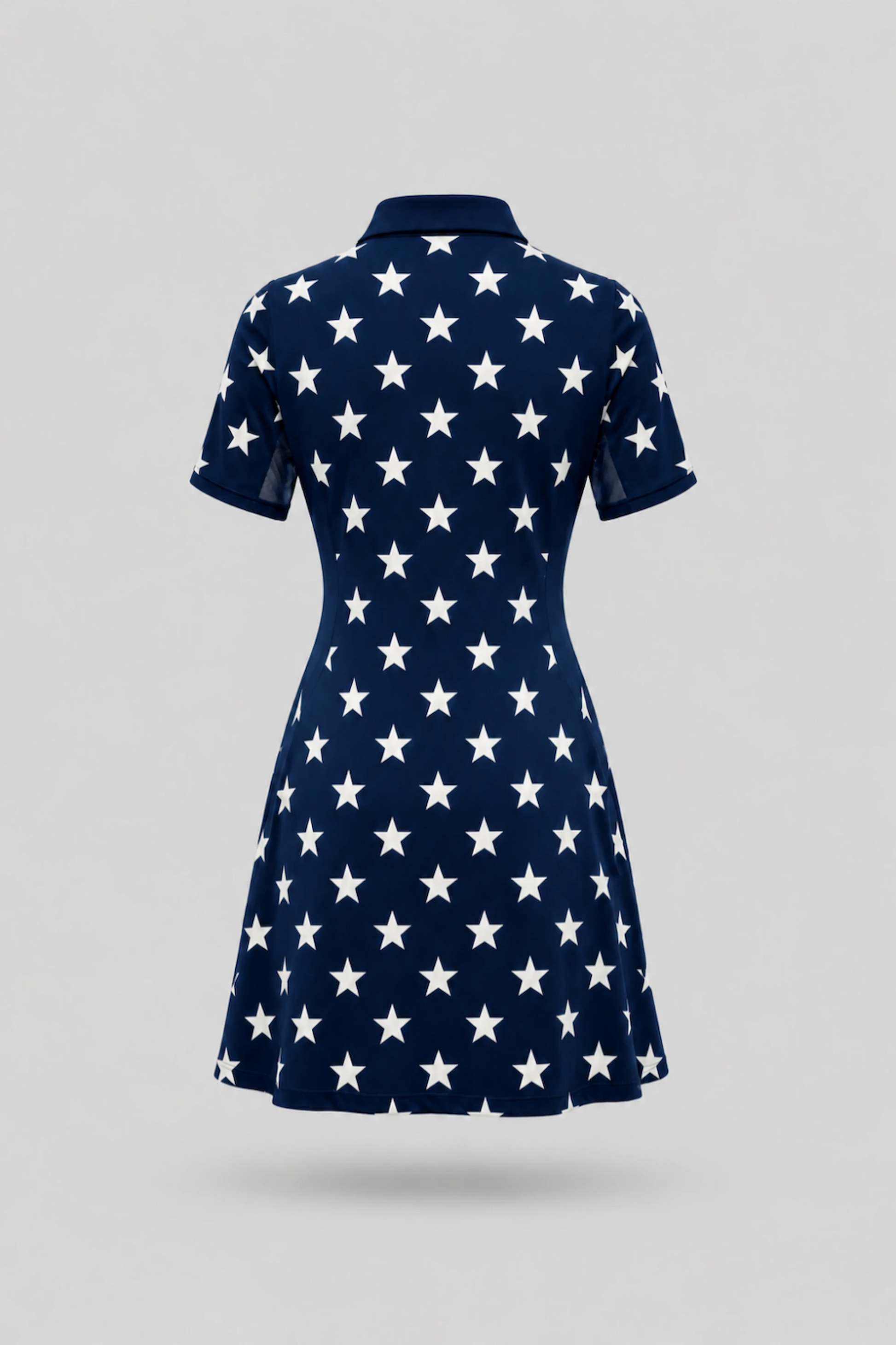 Back view of women's patterned polo golf dress featuring Starfield print and breathable mesh sleeve panels