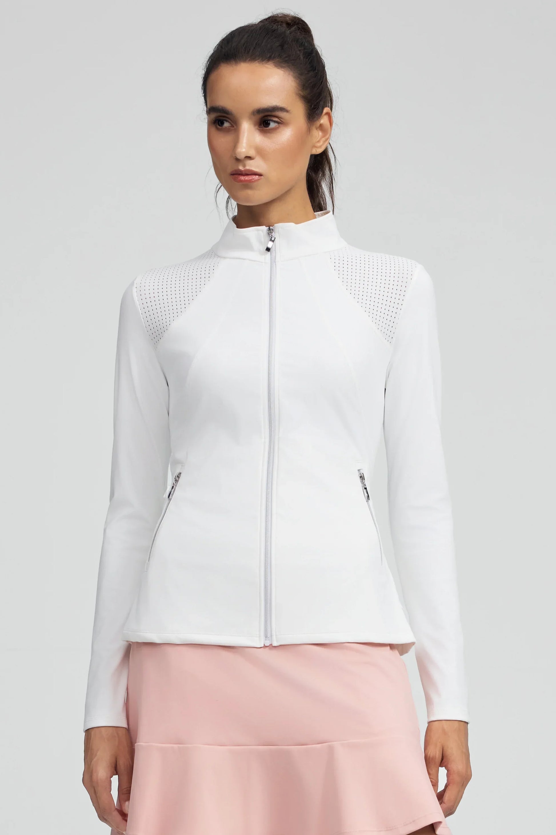 Front view of women’s white peplum mesh-panel zip golf jacket