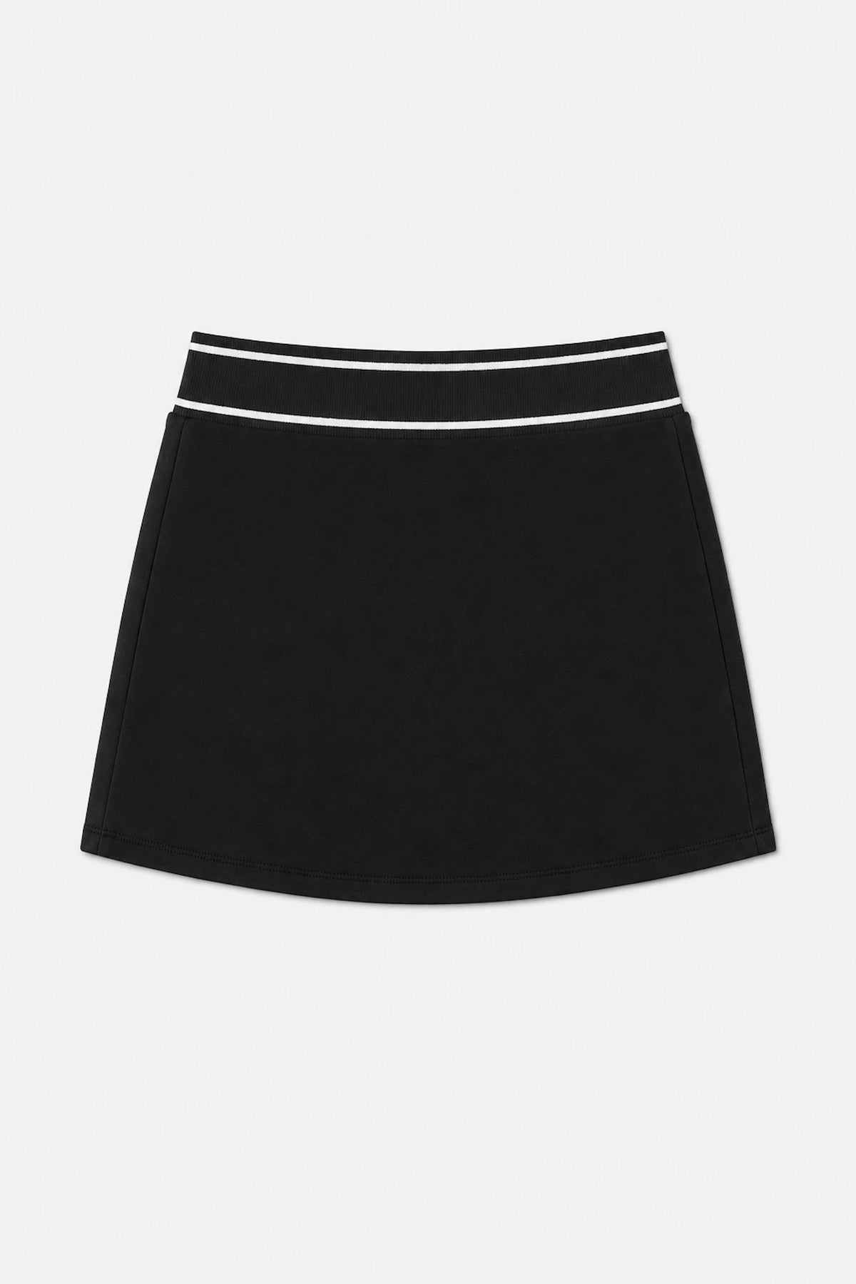 Women’s black performance golf skort flat lay with white striped waistband