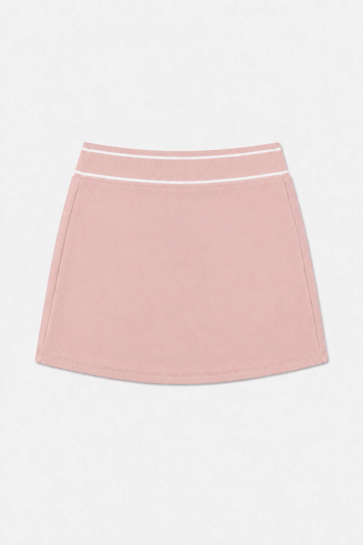 Women’s pink performance golf skort flat lay showing striped waistband and clean front