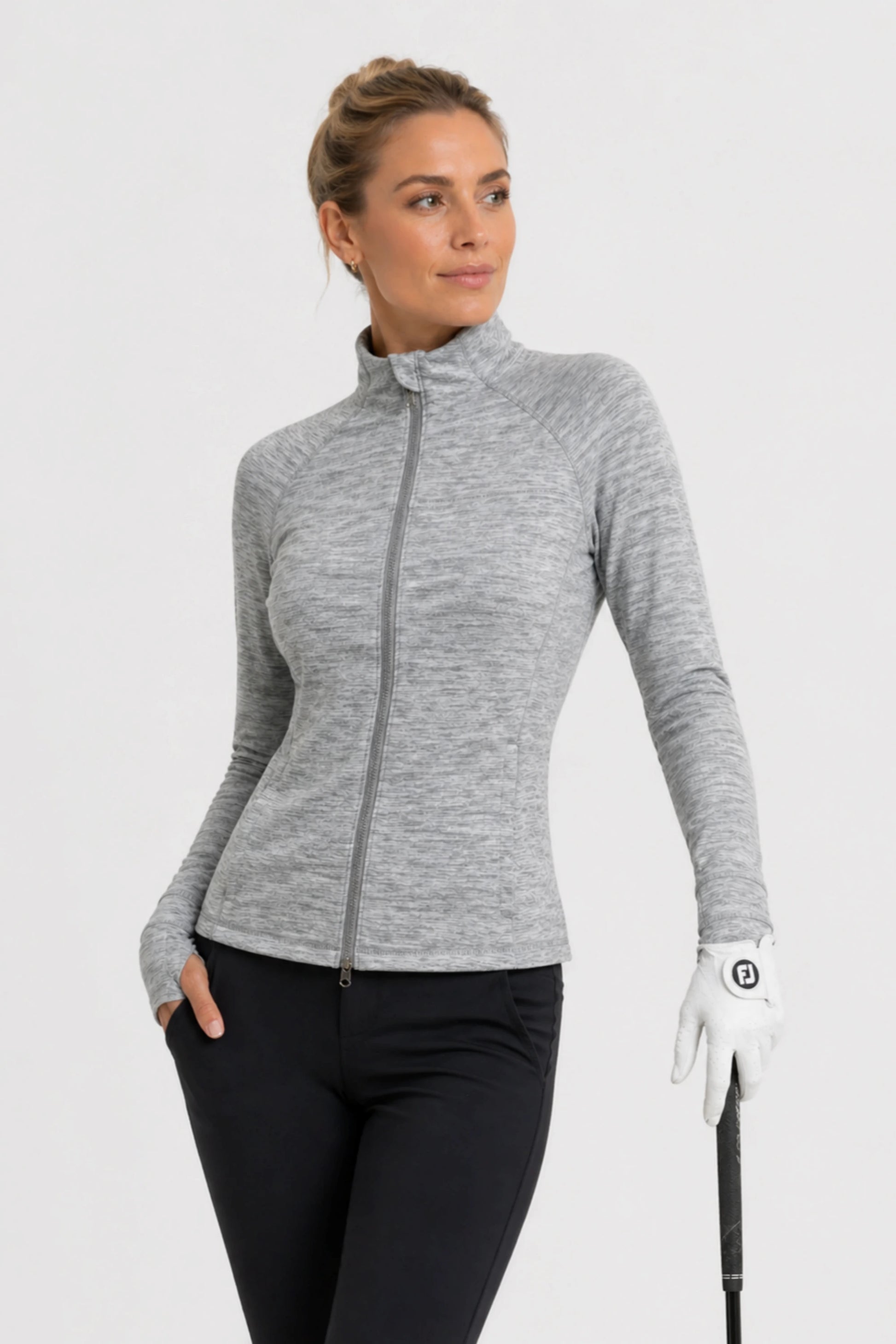 Women’s stretch performance golf jacket in heather grey with full zip front and athletic silhouette