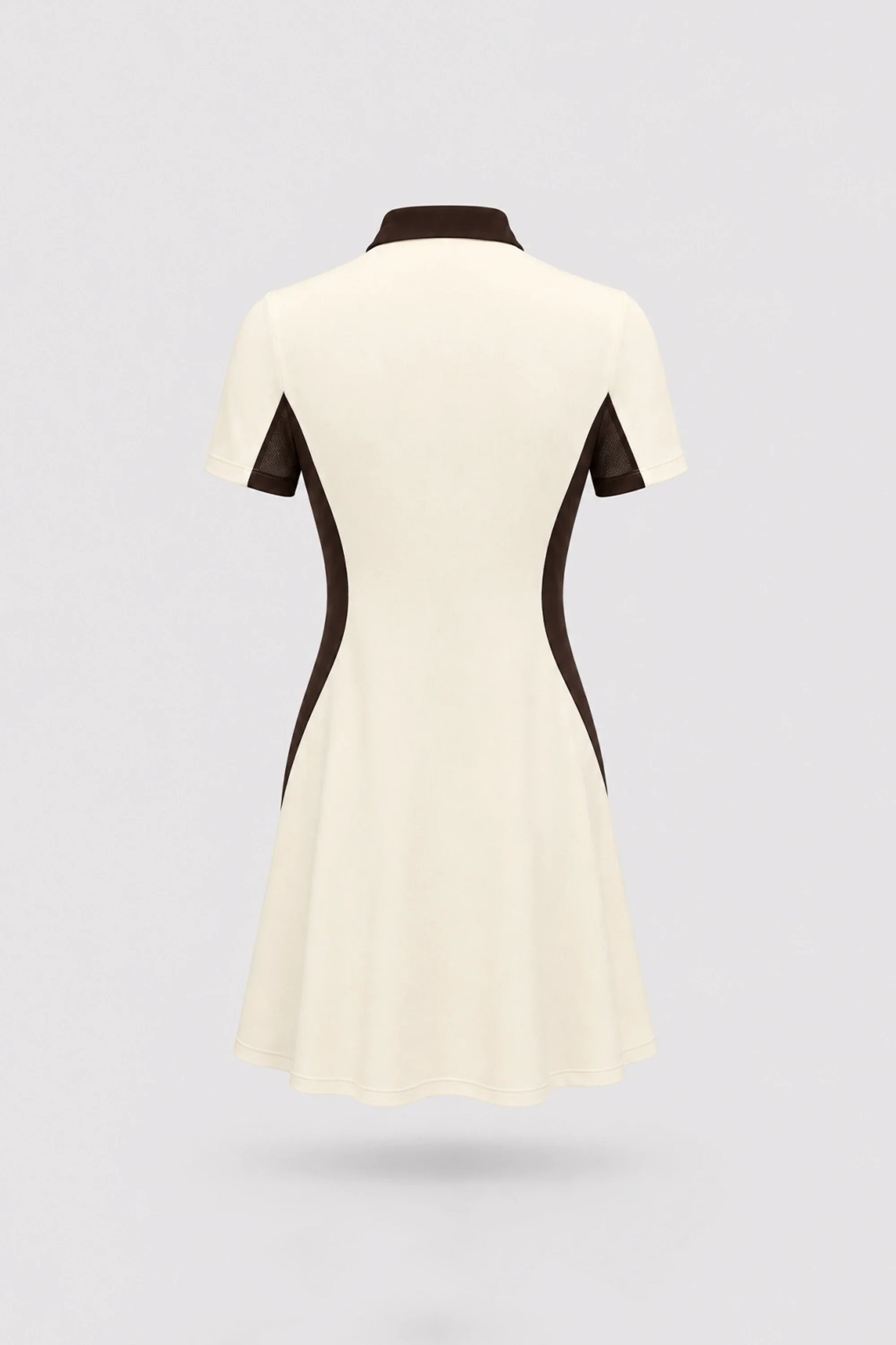 Back view of women's Cream polo golf dress with contoured shaping silhouette and stretch performance fabric