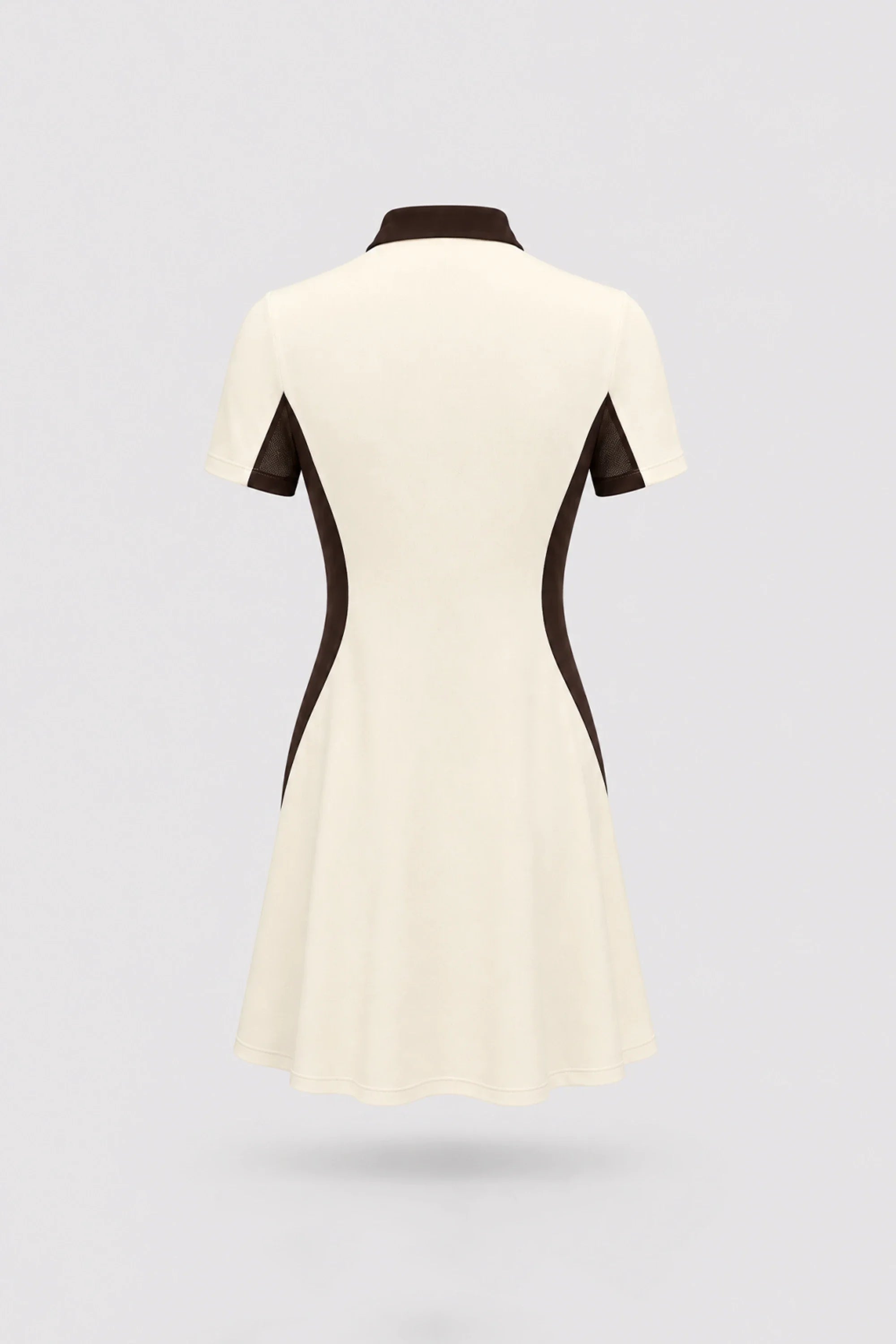 Back view of women's Cream polo golf dress with contoured shaping silhouette and stretch performance fabric