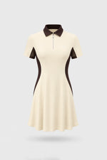 Women's Cream polo golf dress with zip-front collar, contoured shaping silhouette, and stretch performance fabric