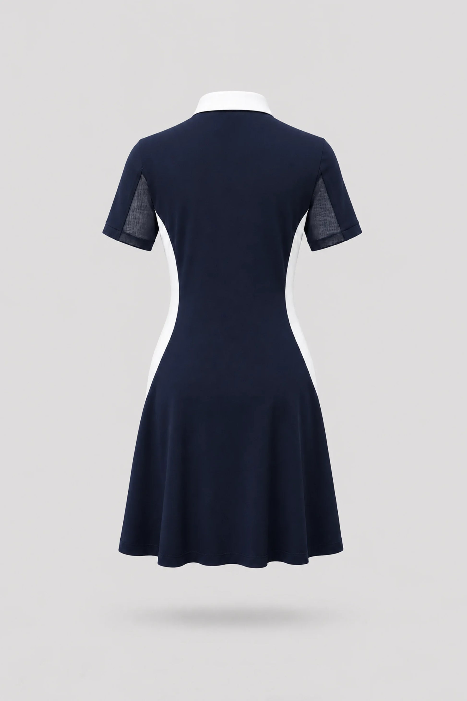 Back view of women's midnight navy polo golf dress with breathable mesh sleeve panels and athletic silhouette