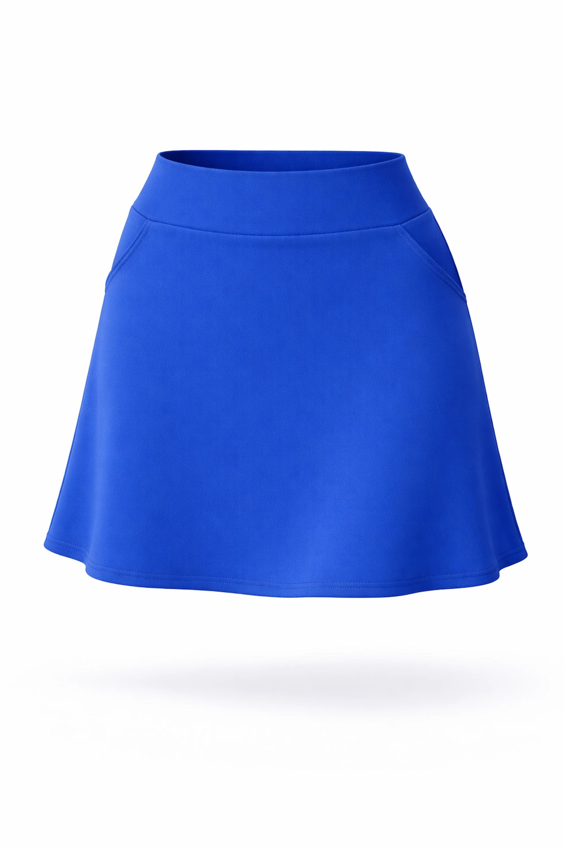 Front view of women’s royal blue A-line UPF 50+ golf skort with pockets