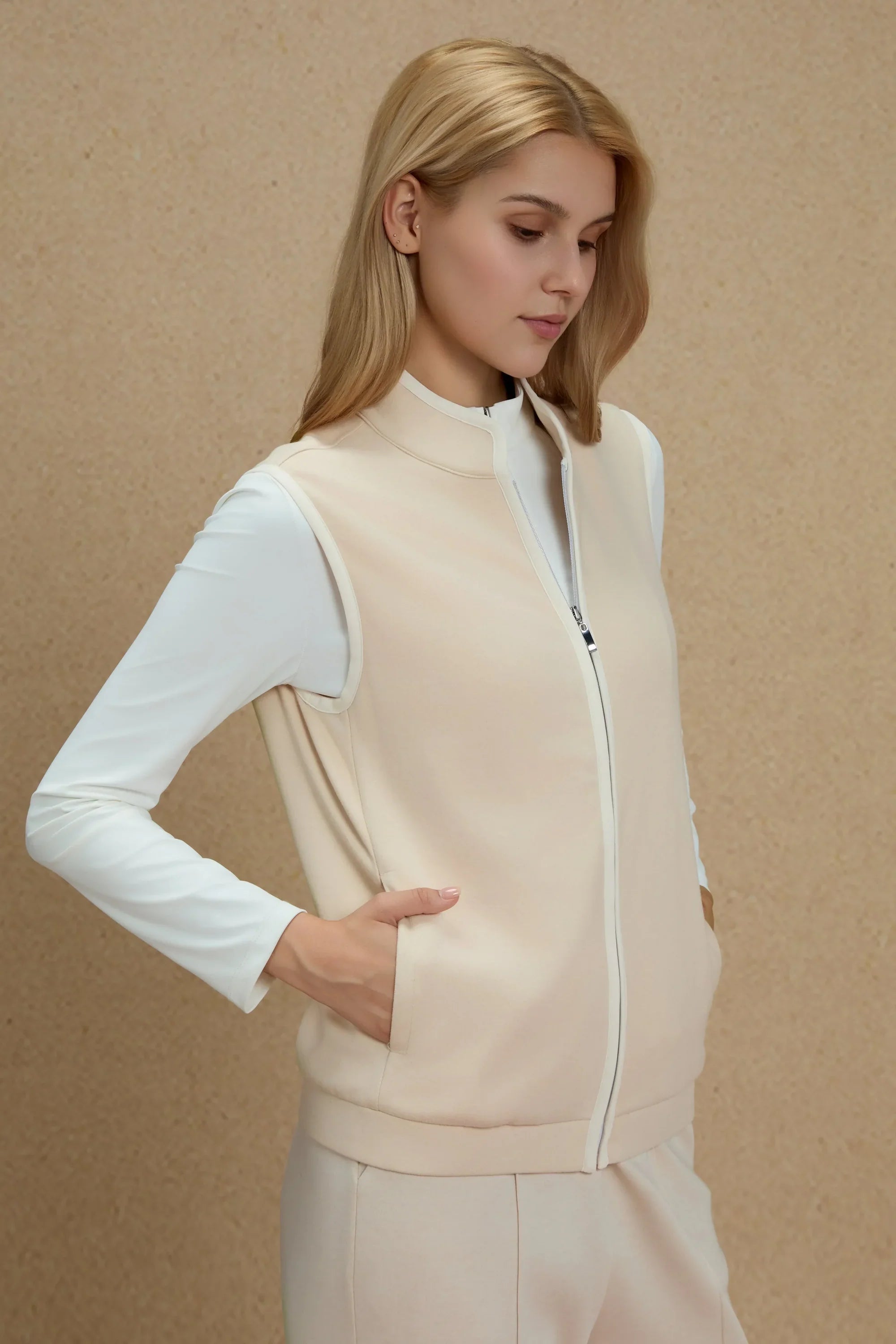 Side view of Women’s Sandstone zip-front golf vest showing functional front pocket detail