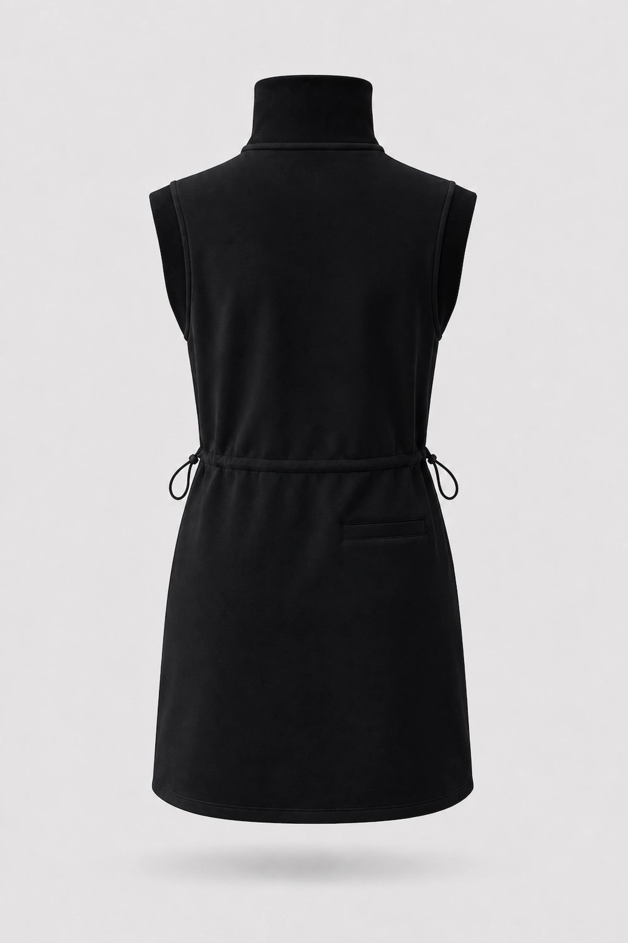 Back view of women's black sleeveless golf dress with stand collar, adjustable drawcord waist and back pocket
