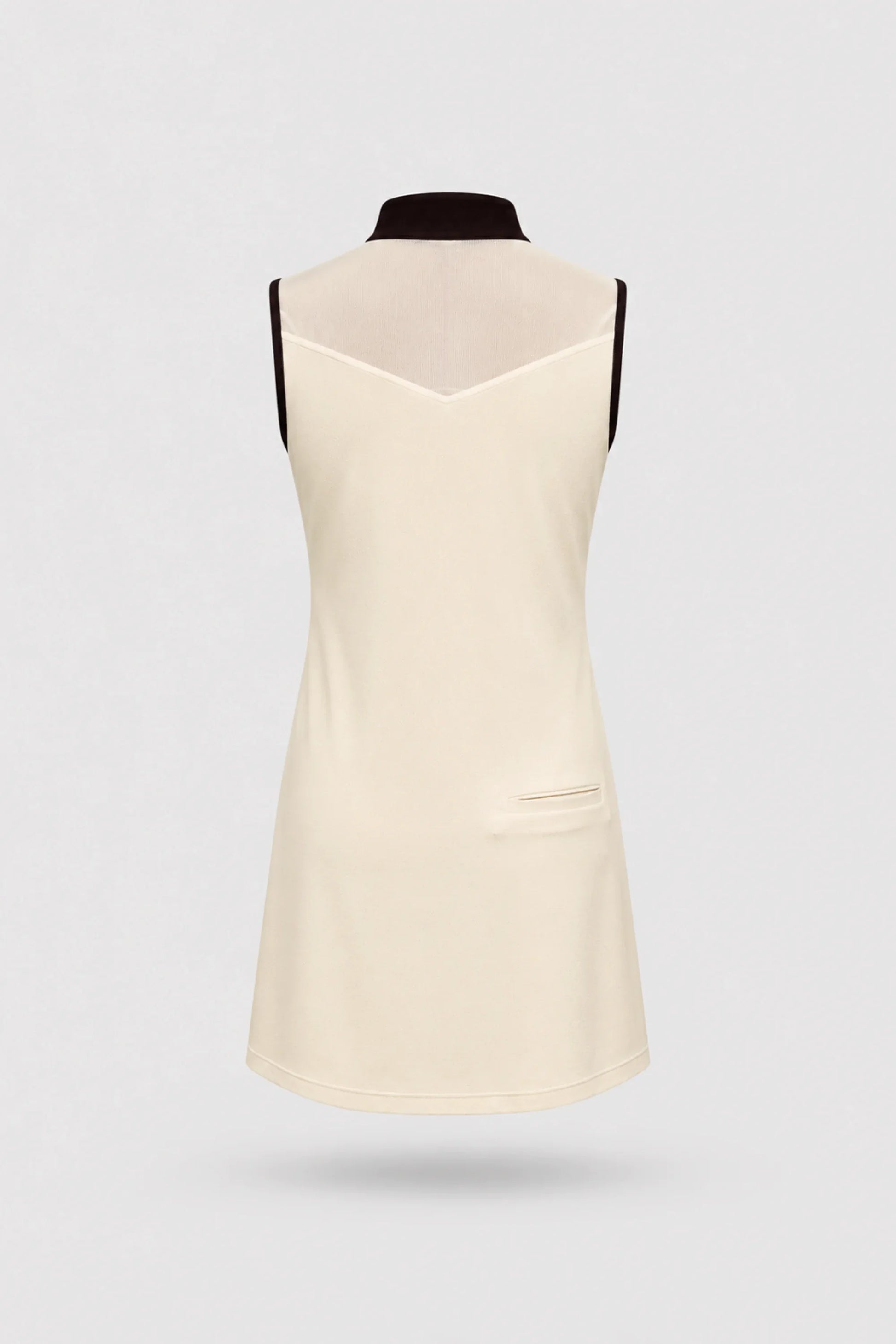 Back view of women's Cream sleeveless golf dress with lightweight stretch performance fabric and athletic silhouette