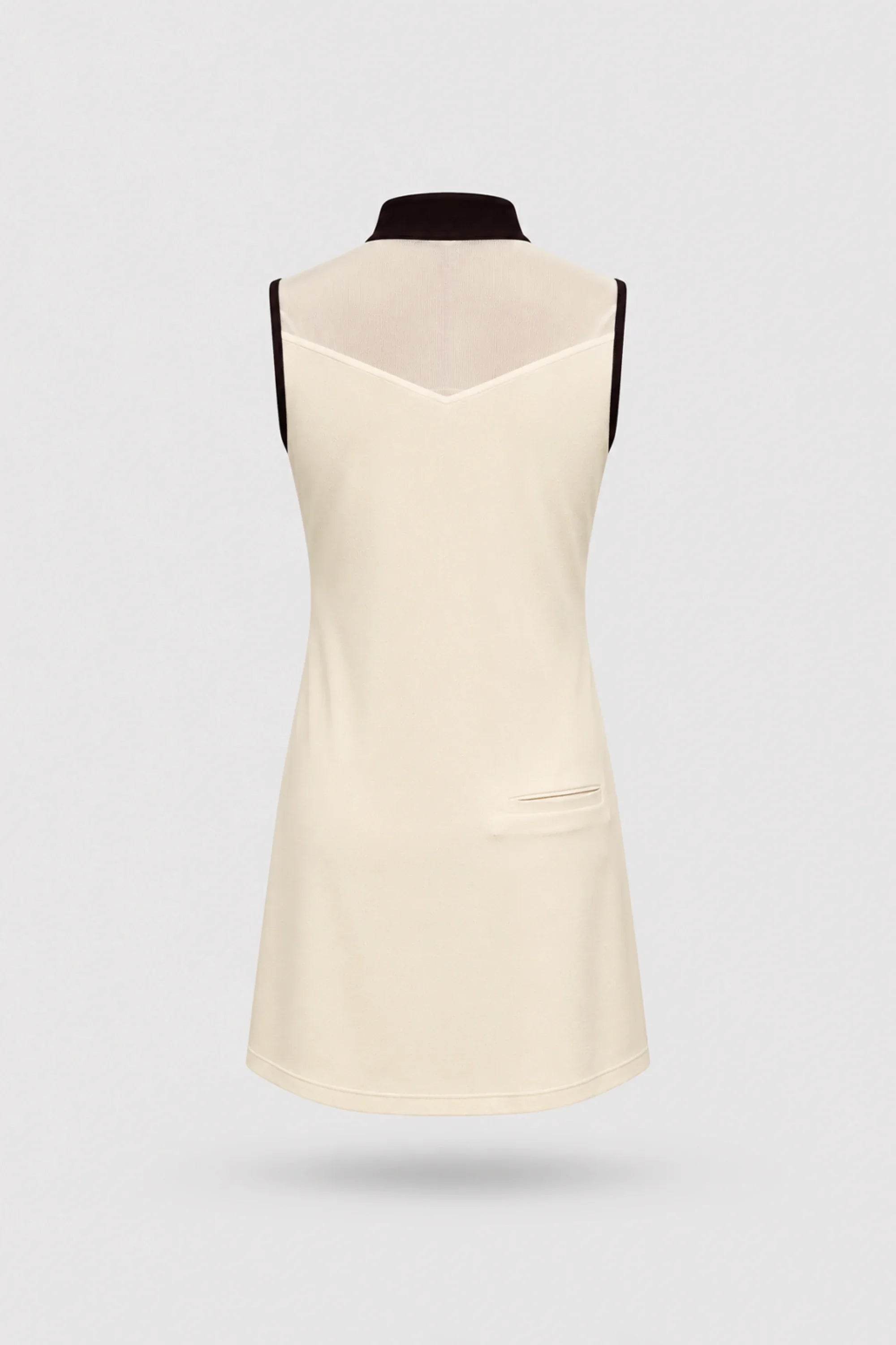 Back view of women's Cream sleeveless golf dress with lightweight stretch performance fabric and athletic silhouette