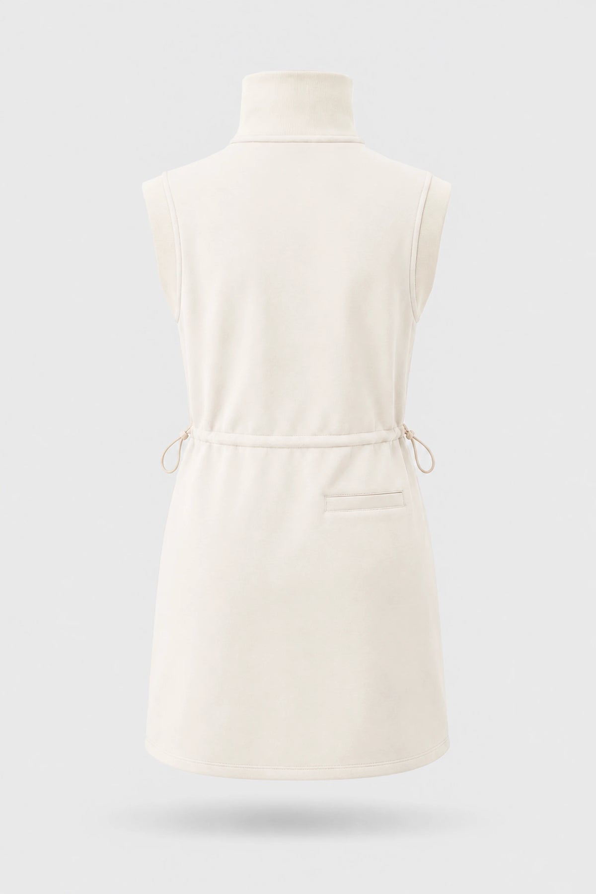 Back view of women's ivory sleeveless golf dress with stand collar, adjustable drawcord waist and back pocket