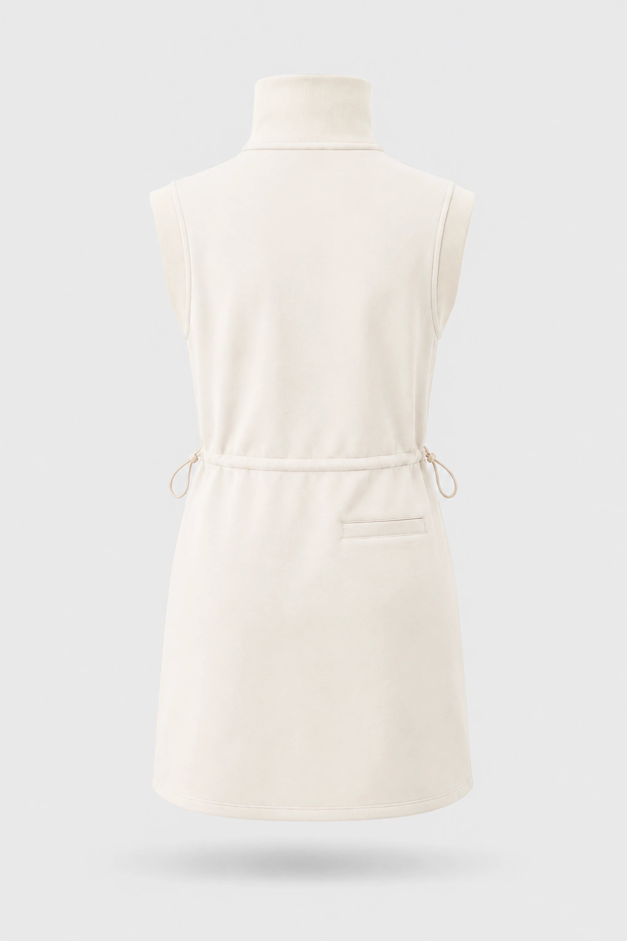 Back view of women's ivory sleeveless golf dress with stand collar, adjustable drawcord waist and back pocket