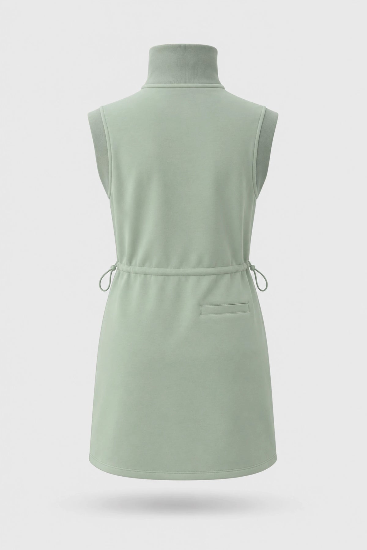 Back view of women's sage green sleeveless golf dress with stand collar, adjustable drawcord waist and back pocket