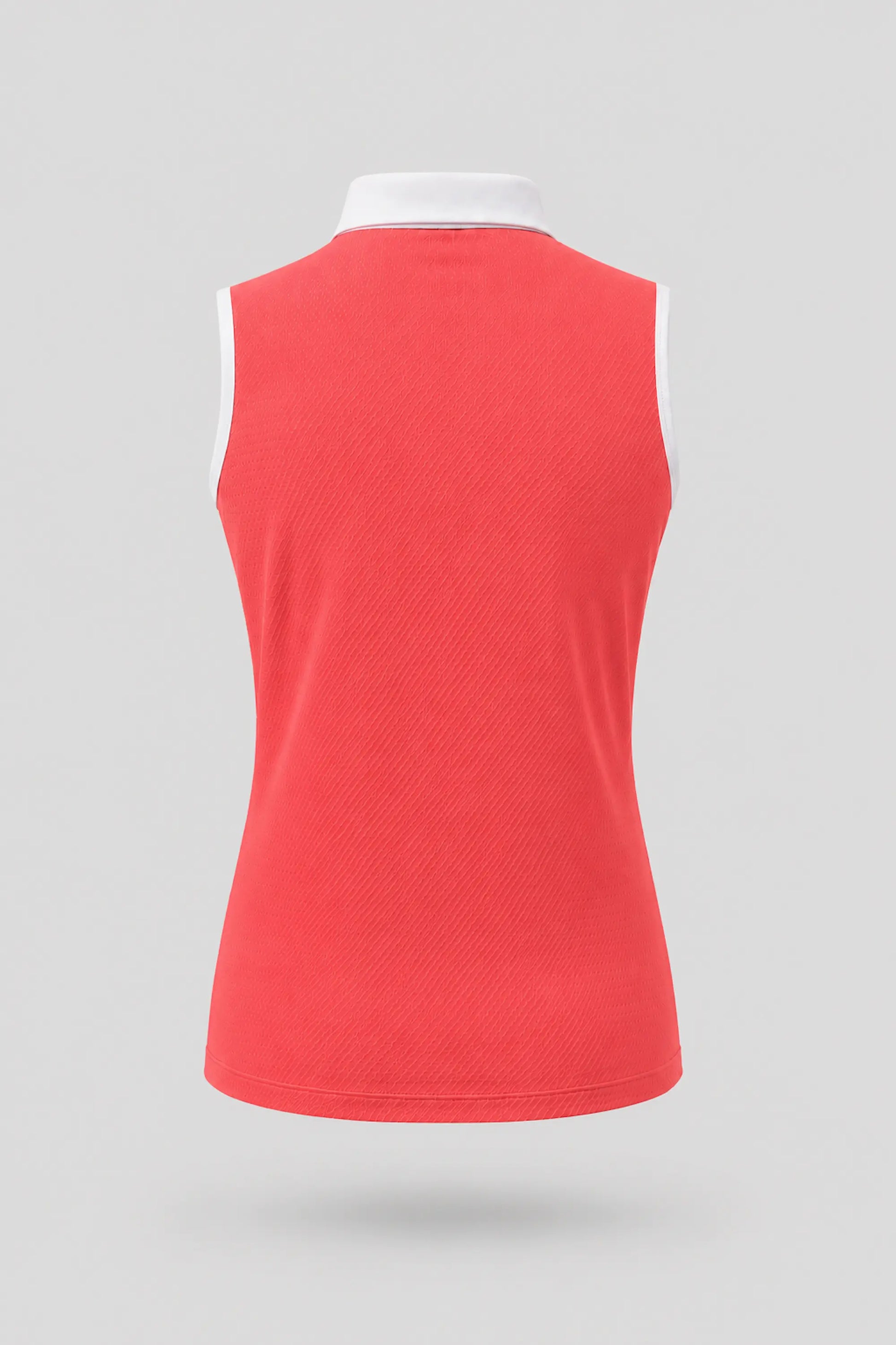 Back view of women's coral red sleeveless golf polo with athletic fit and breathable fabric
