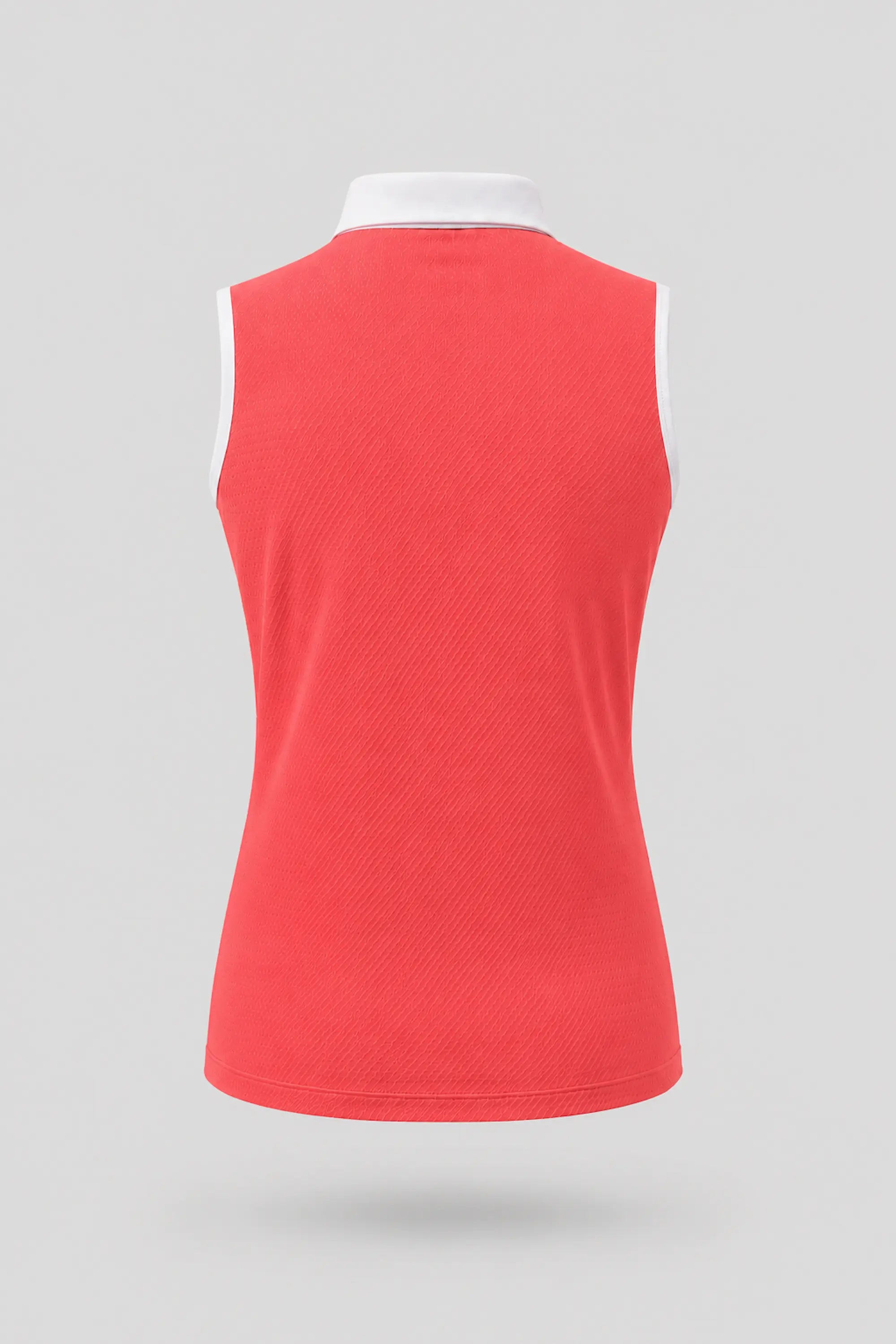 Back view of women's coral red sleeveless golf polo with athletic fit and breathable fabric