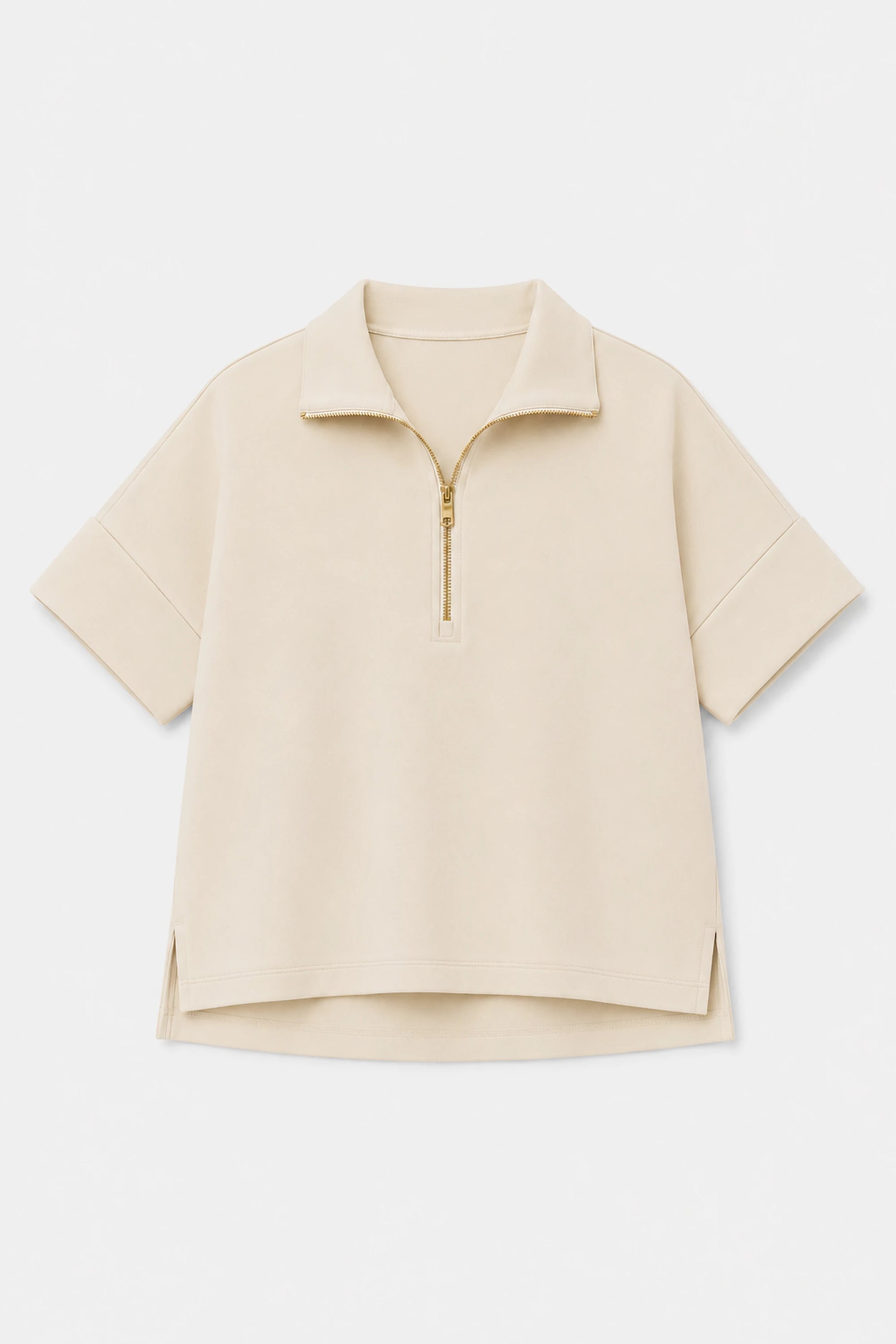 Women’s soft oatmilk performance quarter-zip top shown in flat lay view with minimalist design details