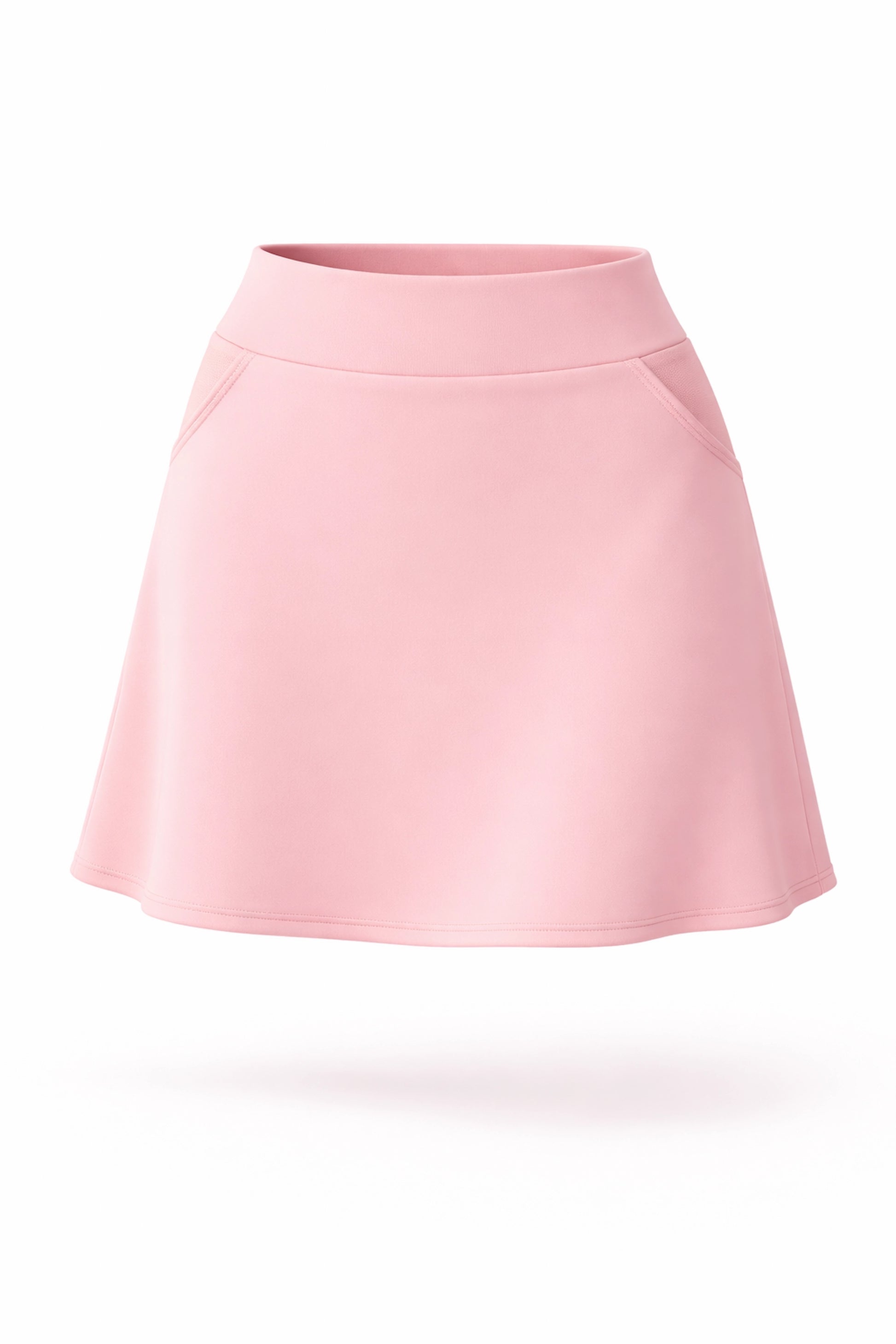 Front view of women’s soft pink A-line UPF 50+ golf skort with pockets