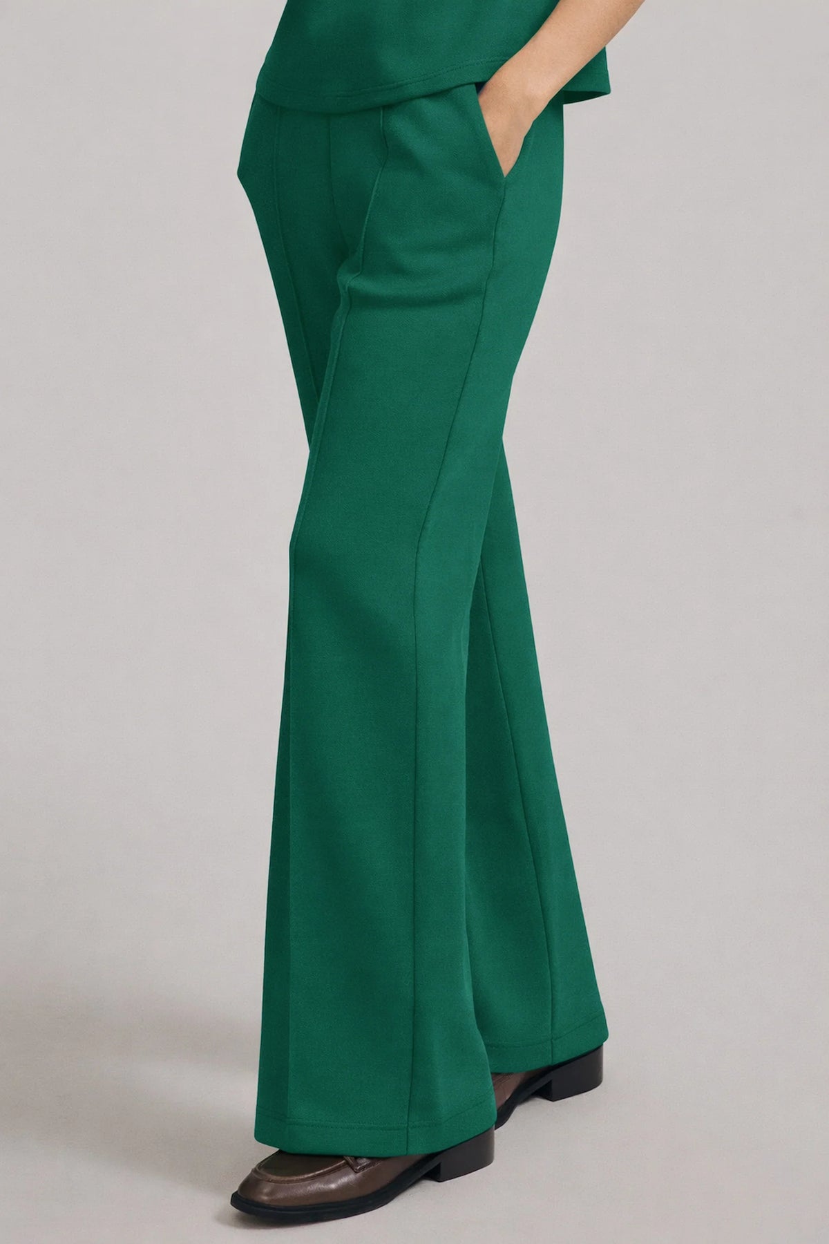 Side view of women's Deep Teal straight-leg pants showing the smooth drape, side pocket and full-length cut