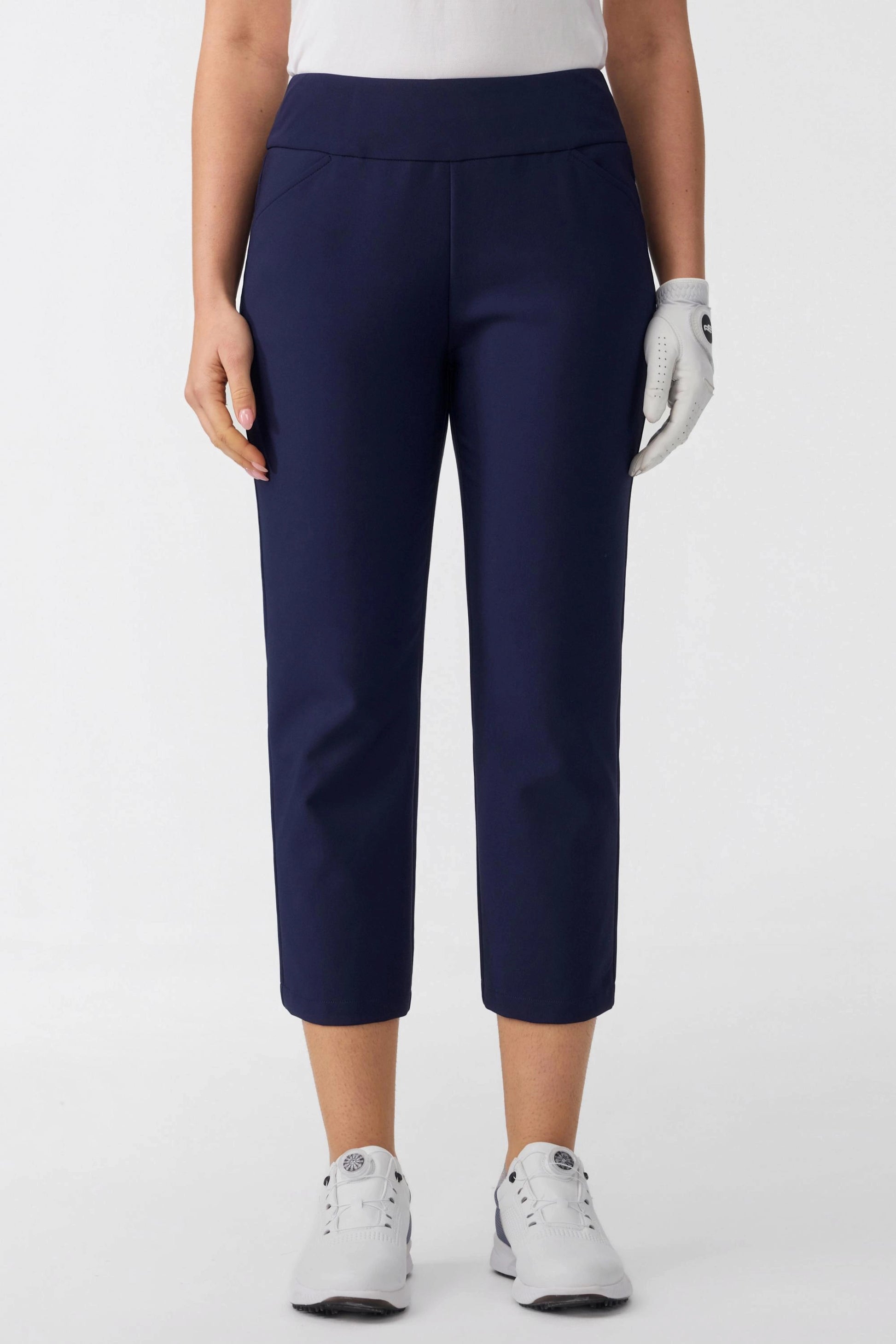 Front view of women’s tailored capri golf pants in midnight navy with a sleek tapered fit