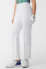 Women’s white tailored golf pants with belt loops and front crease in side view