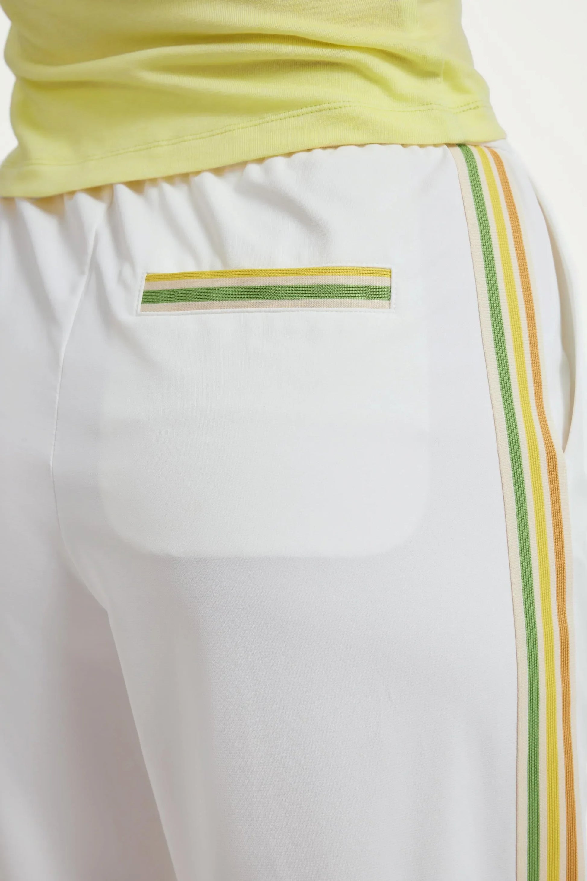 Back pocket detail of women’s classic white wide-leg pants with striped trim