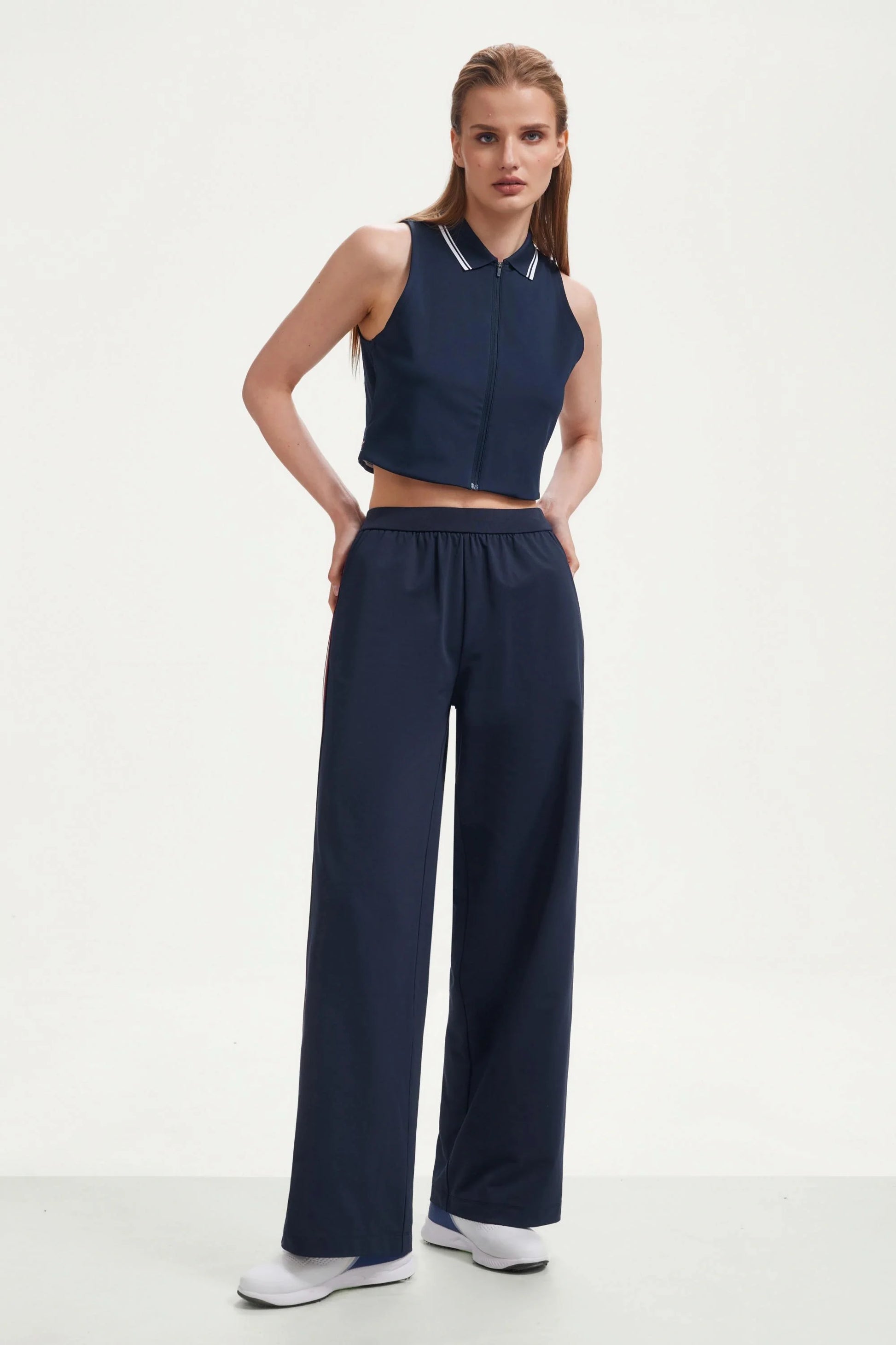 Front view of women’s midnight navy wide-leg pants with side stripes