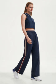 Side look of women’s midnight navy wide-leg pants with contrast side stripes