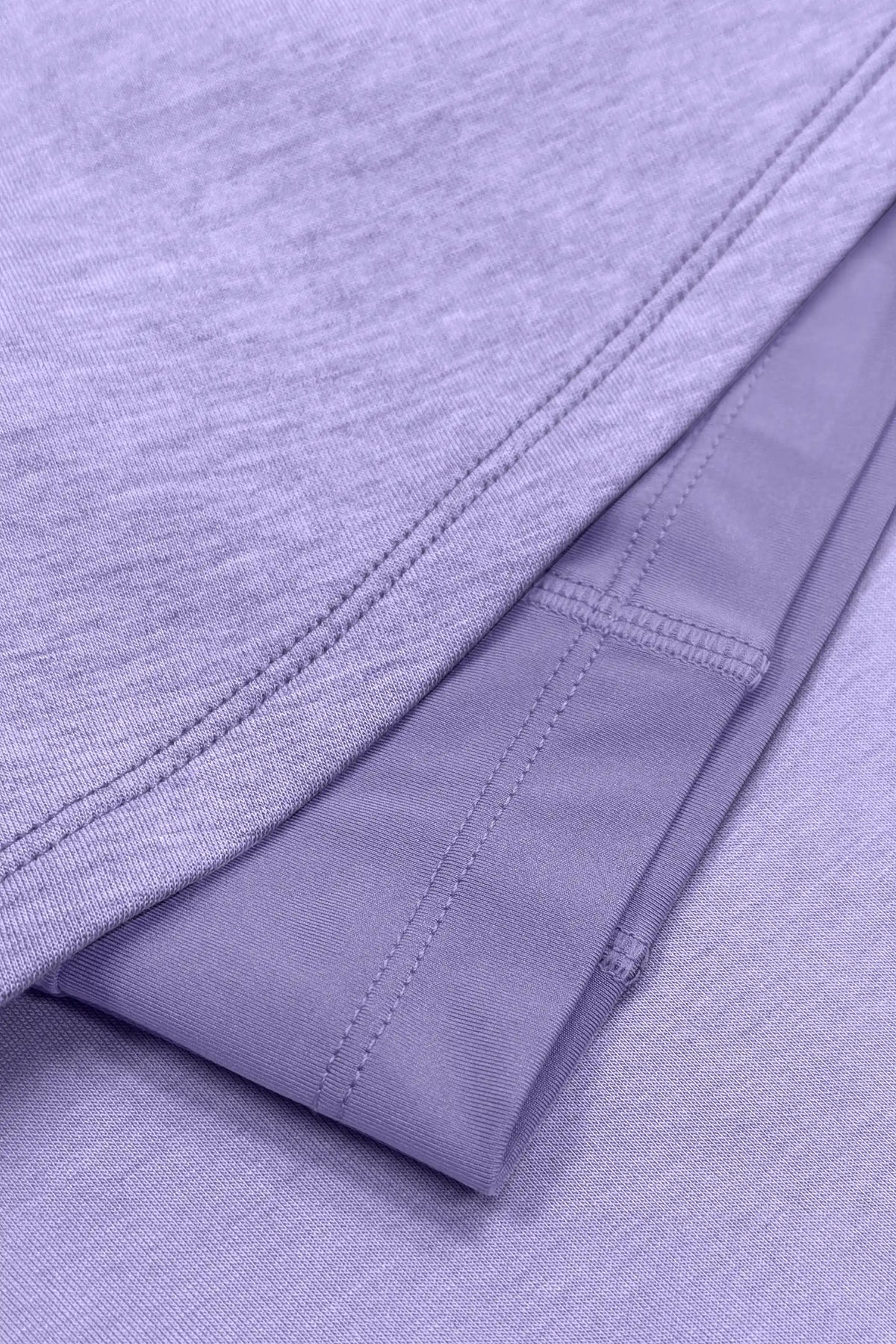 Close-up of the skirt hem stitching and built-in shorts beneath the lavender wrap golf skort