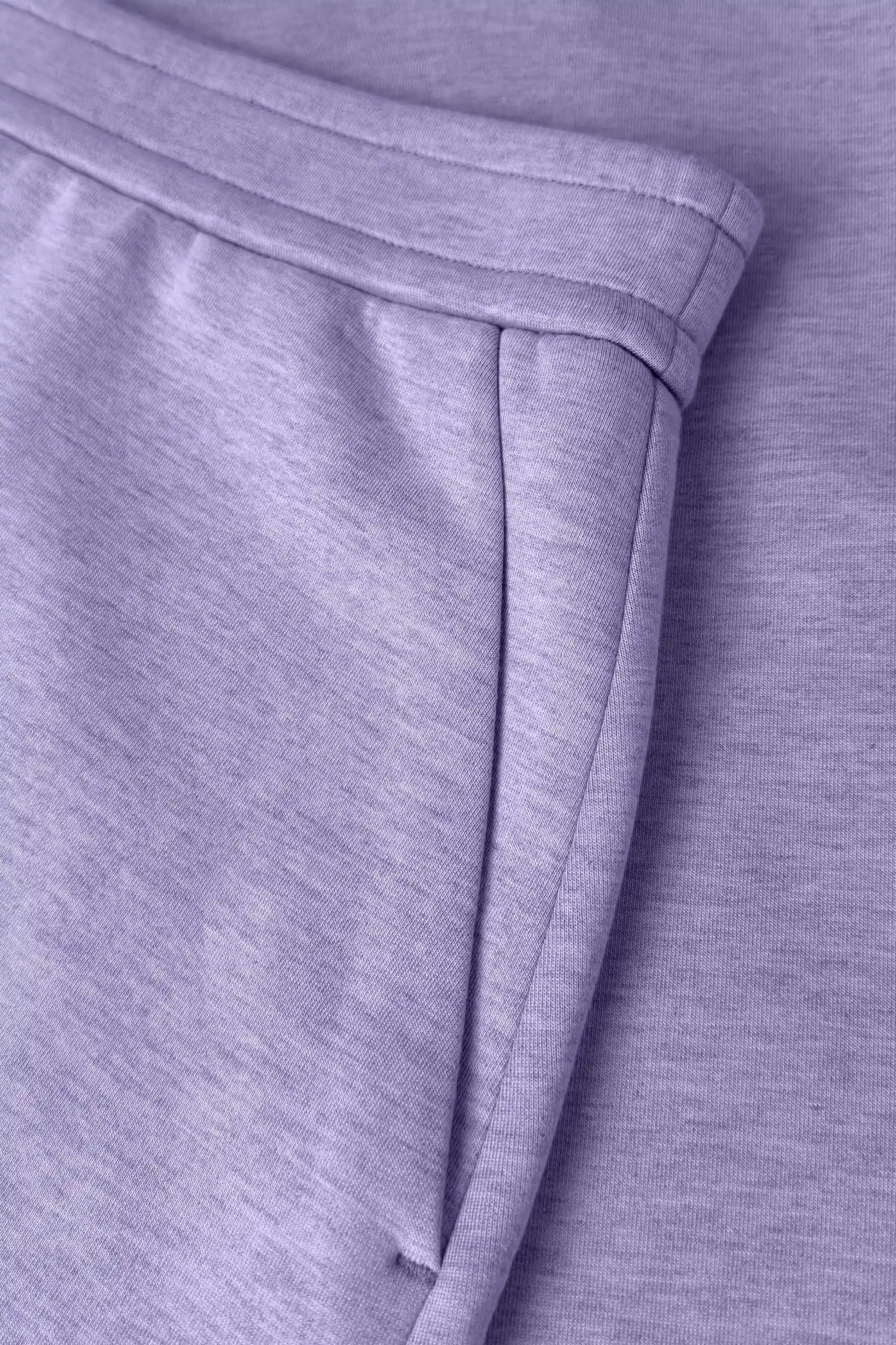 Close-up of women’s lavender wrap golf skort with structured waistband and side pocket detail