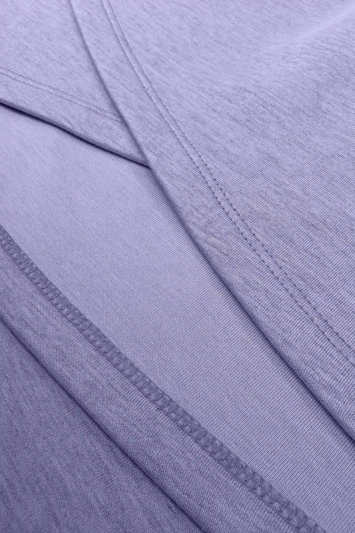 Close-up of the wrap construction and clean seam detailing on the women’s lavender golf skort