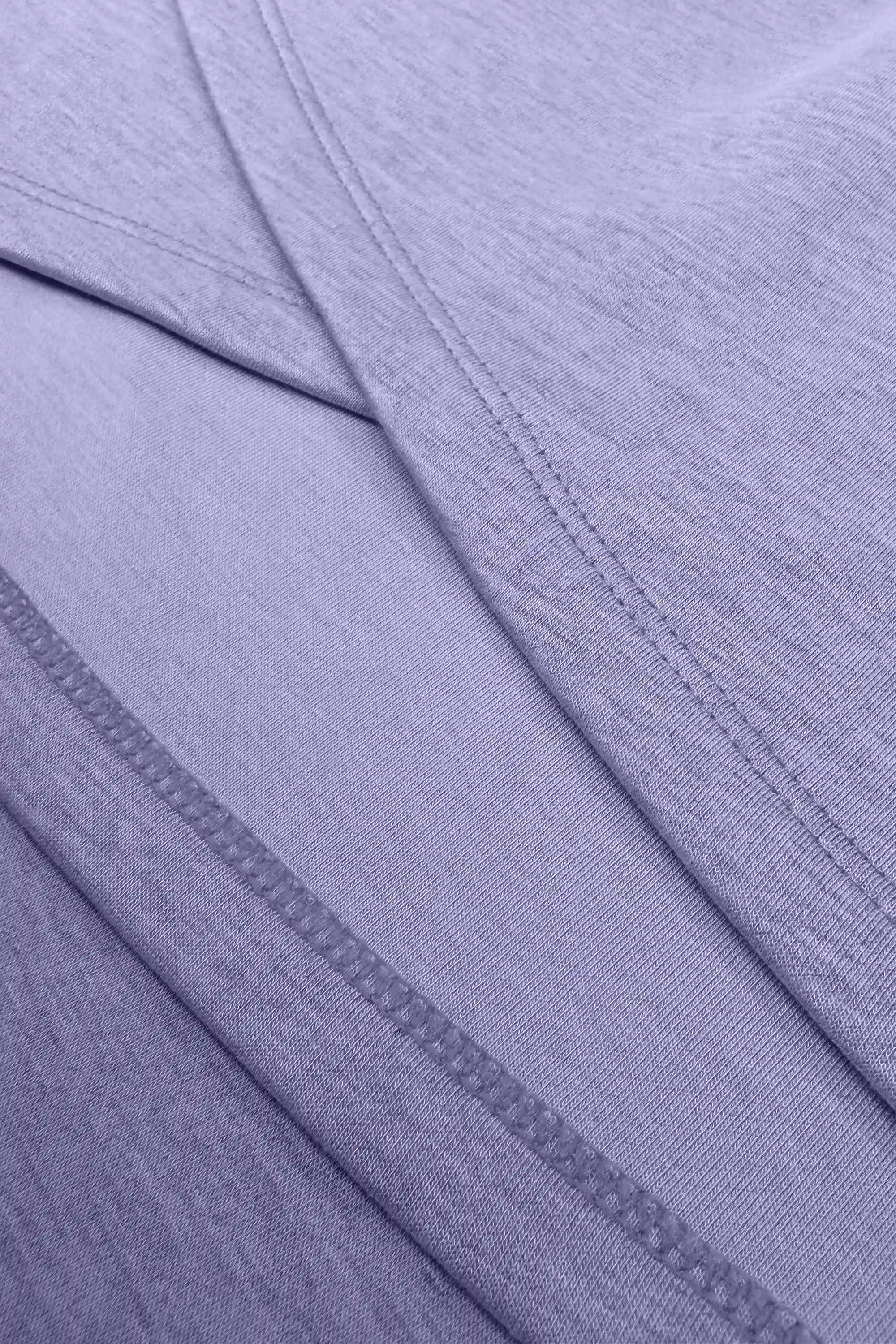 Close-up of the wrap construction and clean seam detailing on the women’s lavender golf skort