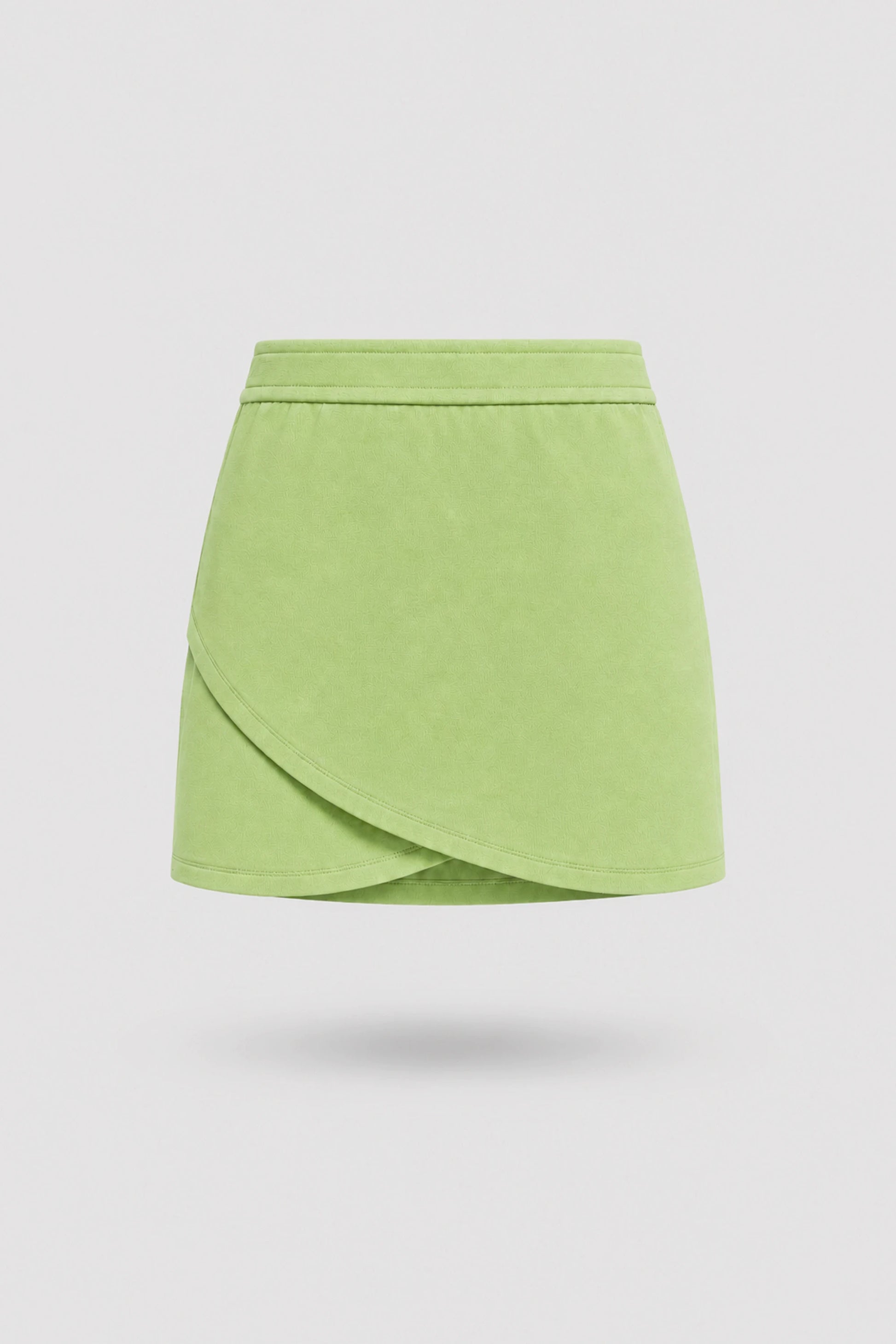 Women's wrap golf skort in lime green with sculpted silhouette and tailored fit