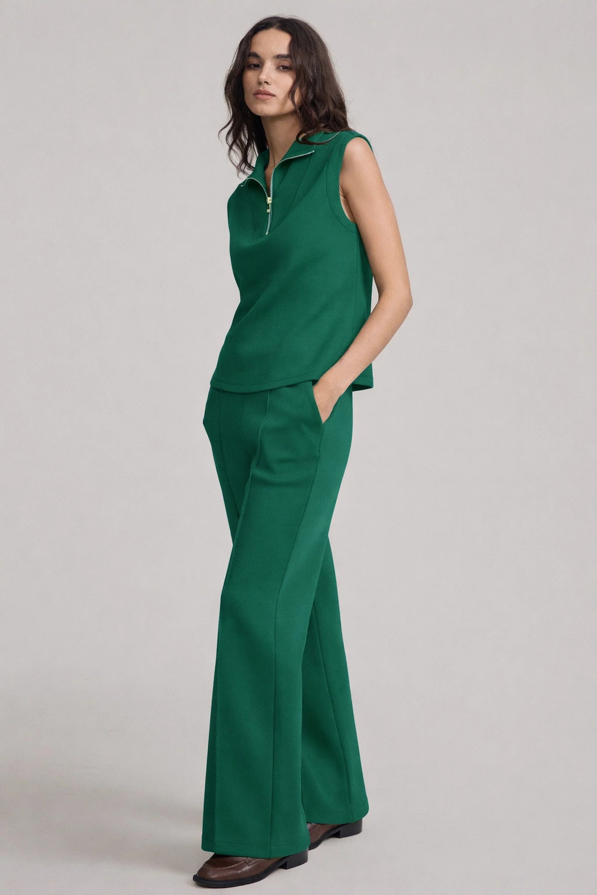 Women’s sleeveless pullover in deep teal styled with matching wide-leg pants